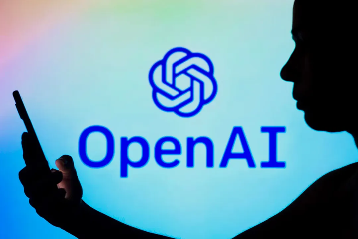 someone-using-phone-openai-logo-dark-shadow